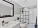 Clean bathroom with a bathtub, shower, and frameless glass enclosure at 4500 Gulf Of Mexico Dr # 305, Longboat Key, FL 34228