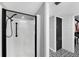 Contemporary bathroom with a walk-in shower and black and white floor tiles at 4500 Gulf Of Mexico Dr # 305, Longboat Key, FL 34228