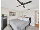 Bedroom with king-size bed, dresser, and ceiling fan at 4500 Gulf Of Mexico Dr # 305, Longboat Key, FL 34228