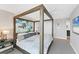 Main bedroom with large bed, modern art, and ensuite bathroom access at 4500 Gulf Of Mexico Dr # 305, Longboat Key, FL 34228