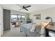 Bedroom with balcony access and view, a king-size bed, and ceiling fan at 4500 Gulf Of Mexico Dr # 305, Longboat Key, FL 34228