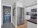 Entryway with stylish patterned floor and modern front door at 4500 Gulf Of Mexico Dr # 305, Longboat Key, FL 34228