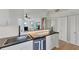Modern kitchen with stainless steel appliances and white cabinets at 4500 Gulf Of Mexico Dr # 305, Longboat Key, FL 34228