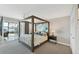 Main bedroom with a large canopy bed and water views at 4500 Gulf Of Mexico Dr # 305, Longboat Key, FL 34228