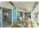Sunroom with water views and a dining table at 4500 Gulf Of Mexico Dr # 305, Longboat Key, FL 34228