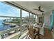 Sunroom showcasing water views and a dining area at 4500 Gulf Of Mexico Dr # 305, Longboat Key, FL 34228