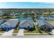 Aerial view of three lakefront homes in a community at 4522 Egmont Dr, Bradenton, FL 34203