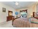 Spacious bedroom with king-size bed and en-suite bathroom access at 4522 Egmont Dr, Bradenton, FL 34203