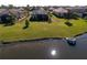 Aerial view of home by the lake at 4824 Heinman Cv, Palmetto, FL 34221