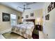 Spacious bedroom with a king-size bed and en-suite bathroom at 4824 Heinman Cv, Palmetto, FL 34221