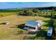 Aerial shot of the property featuring horse barn, pasture and lake views at 4939 Myakka Valley Trl, Sarasota, FL 34241