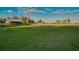 Property featuring horse barn, green pasture, and fence at 4939 Myakka Valley Trl, Sarasota, FL 34241