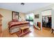 Cozy bedroom with wood floors, a unique horse themed decor and an ensuite closet at 4939 Myakka Valley Trl, Sarasota, FL 34241
