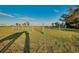 Image shows horse corral with pasture in the distance at 4939 Myakka Valley Trl, Sarasota, FL 34241