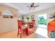 Dining area with hardwood floors and a large sliding glass door for natural light at 4939 Myakka Valley Trl, Sarasota, FL 34241