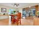 Open dining area with hardwood floors and a view into the kitchen at 4939 Myakka Valley Trl, Sarasota, FL 34241