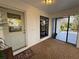 Welcoming screened-in entryway with a decorative front door and neutral tones at 4939 Myakka Valley Trl, Sarasota, FL 34241