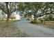 Charming home with a large front yard and mature trees at 4939 Myakka Valley Trl, Sarasota, FL 34241