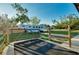 View of the horse trailer parked on the property, showing the secure fencing and open space at 4939 Myakka Valley Trl, Sarasota, FL 34241