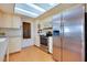 Bright kitchen with stainless steel appliances, and skylight at 4939 Myakka Valley Trl, Sarasota, FL 34241