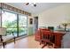 Comfortable office space with a spacious wooden desk, large window, and outdoor views at 4939 Myakka Valley Trl, Sarasota, FL 34241