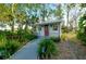 Charming outbuilding surrounded by lush greenery at 4939 Myakka Valley Trl, Sarasota, FL 34241