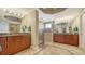 Luxurious bathroom featuring double vanities with granite countertops and a spacious glass-enclosed shower at 505 S Orange Ave # 501, Sarasota, FL 34236