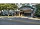 Elegant building entrance featuring a porte-cochère, lush landscaping, and the 'KANAYA' name displayed prominently at 505 S Orange Ave # 501, Sarasota, FL 34236