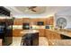 Spacious kitchen features custom cabinetry, granite countertops, a center island, and stainless steel appliances at 505 S Orange Ave # 501, Sarasota, FL 34236