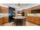 Modern kitchen with stainless steel appliances, custom cabinets, and a center island at 505 S Orange Ave # 501, Sarasota, FL 34236