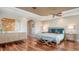 Inviting main bedroom features hardwood floors, a decorative tray ceiling, and custom furnishings at 505 S Orange Ave # 501, Sarasota, FL 34236