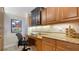 Cozy office area features custom cabinets, granite countertops, and a built-in desk at 505 S Orange Ave # 501, Sarasota, FL 34236