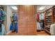 Custom walk-in closet boasts built-in shelves, drawers, and ample hanging space for clothes and accessories at 505 S Orange Ave # 501, Sarasota, FL 34236