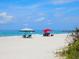 Beach scene with two canopies and people relaxing at 5303 Coral Blvd, Bradenton, FL 34210