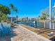 Wooden dock with seating area and boat lift at 5303 Coral Blvd, Bradenton, FL 34210