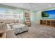 Relaxing living room featuring sectional sofa and media console at 5303 Coral Blvd, Bradenton, FL 34210