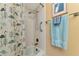 Bathroom with shower/tub combo and light blue towels at 535 Spring Lakes Blvd, Bradenton, FL 34210