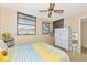 Bedroom with large window and ceiling fan at 535 Spring Lakes Blvd, Bradenton, FL 34210
