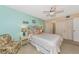 Bright bedroom with a ceiling fan and coastal decor at 535 Spring Lakes Blvd, Bradenton, FL 34210