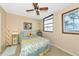 Bedroom with sunflower decor and ceiling fan at 535 Spring Lakes Blvd, Bradenton, FL 34210