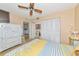 Bedroom with white dresser and partial kitchen view at 535 Spring Lakes Blvd, Bradenton, FL 34210