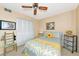 Bedroom with ceiling fan and built-in closet at 535 Spring Lakes Blvd, Bradenton, FL 34210