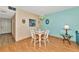 Bright dining area with white table and chairs, and a chandelier at 535 Spring Lakes Blvd, Bradenton, FL 34210