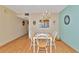 Cozy dining area with a small table and chandelier at 535 Spring Lakes Blvd, Bradenton, FL 34210