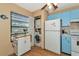 Small laundry area with a washer and dryer at 535 Spring Lakes Blvd, Bradenton, FL 34210