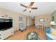 Living room features hardwood floors, comfy seating and a ceiling fan at 535 Spring Lakes Blvd, Bradenton, FL 34210