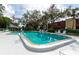 Community swimming pool with lounge chairs and a depth of 6ft 3in at 535 Spring Lakes Blvd, Bradenton, FL 34210