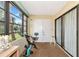 Screened porch with exercise bike, white furniture and view of the outdoors at 535 Spring Lakes Blvd, Bradenton, FL 34210