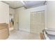 Neutral bedroom includes carpet, closet and view into an adjacent room at 5376 Royal Palm Ave # 5376, Sarasota, FL 34234