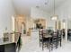 Well-lit dining room with tile floors, decorative chandelier, and dining table with chairs at 5376 Royal Palm Ave # 5376, Sarasota, FL 34234